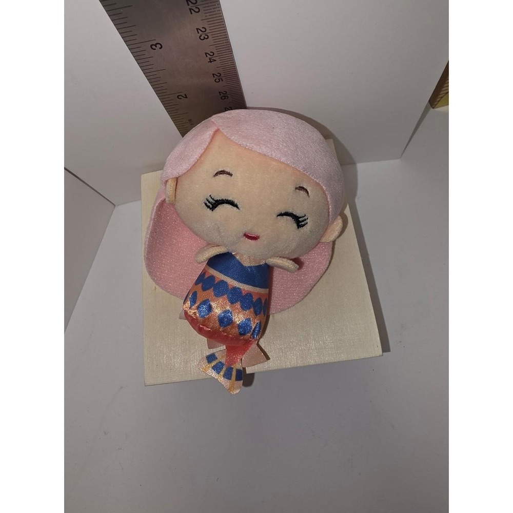 Disney Little Mermaid Caspia mini plush features a soft, light pink hairstyle